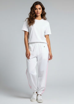 BubiniSegreti Roberta Biagi Damen-Jogginghose in Weiß mit rosa Seitenstreifen und elastischen Beinabschlüssen.