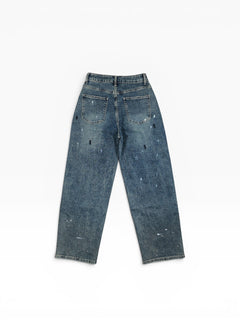 BubiniSegreti weite Jeanshose aus blauem Denim mit künstlerischem Paint-Splatter-Design und Five-Pocket-Stil.