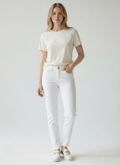 Model wearing BubiniSegreti white Roberta Biagi straight-leg cotton denim jeans with a beige t-shirt and loafers